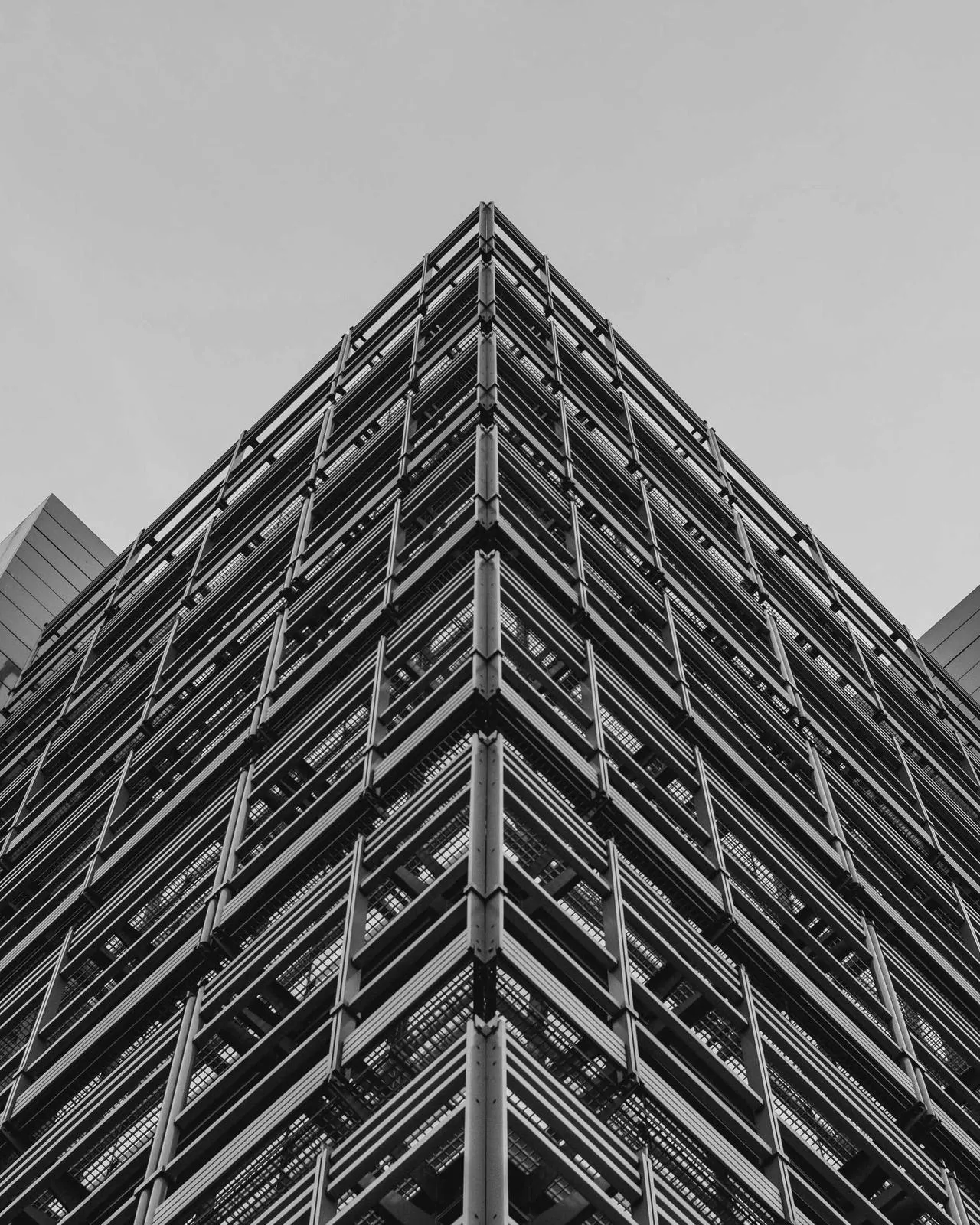 Repeating balconies of a housing block in flat light